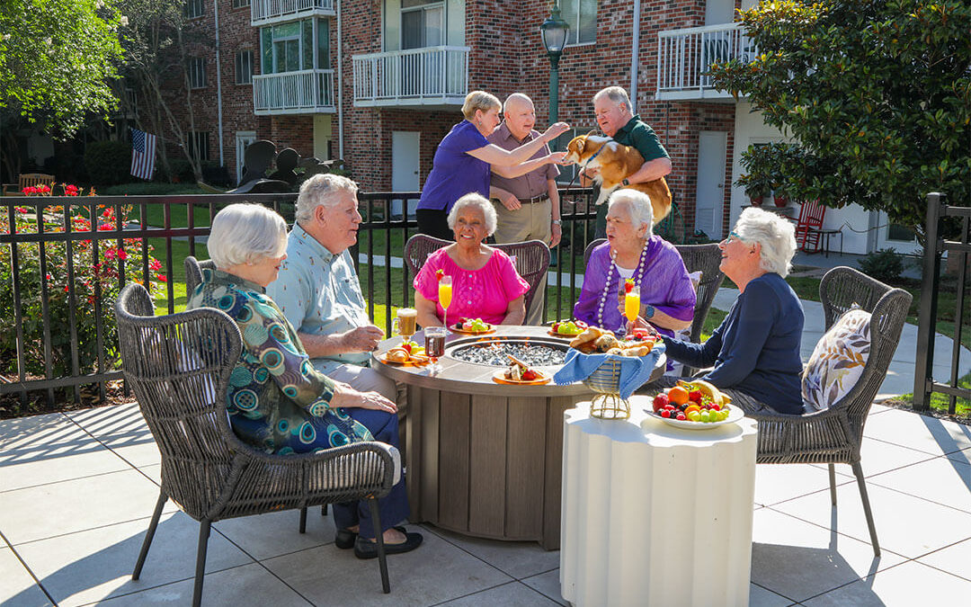 Group of friends sitting around a firepit.